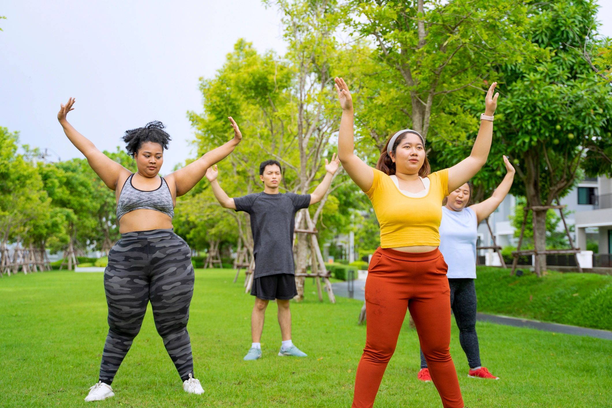 Group of adults heading to an outdoor workout session